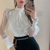 Blusa de punto con cuello semialto y manga larga